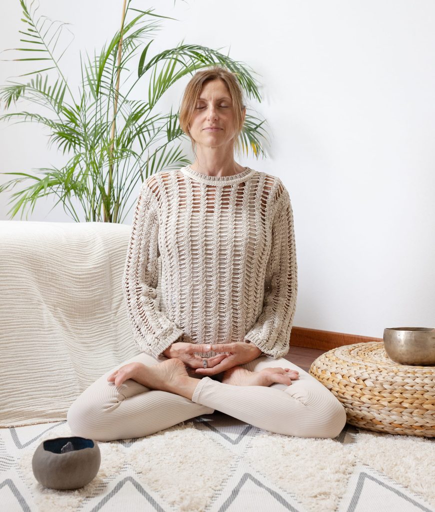 Portrait of Valentina Pilenga meditating in the lotus position
